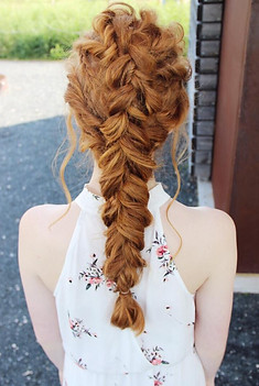 Long textured ginger braid styled down the back