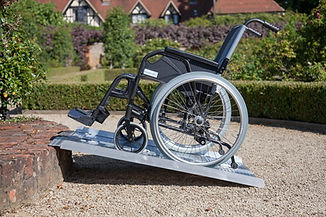 Picture of a wheelchair on an portable aluminum ramp