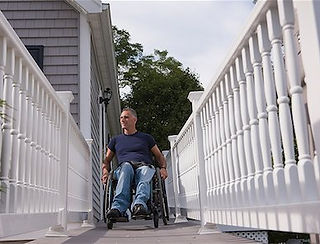 man descending a custom wood ramp