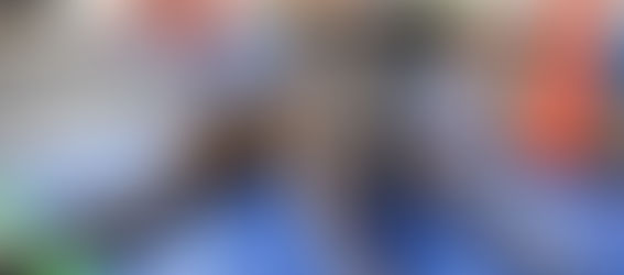 brindle boxer laying on gym mat