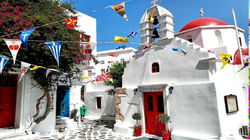 Mykonos magic - white alleys, pink blooms, blue sea