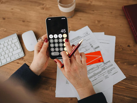 A woman paying nursery bills