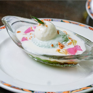 Chilled Pandan Sago Gula Melaka dessert featuring creamy coconut milk and sweet palm sugar syrup drizzle.