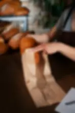 female-baker-with-baked-bread-pastry-shop.webp
