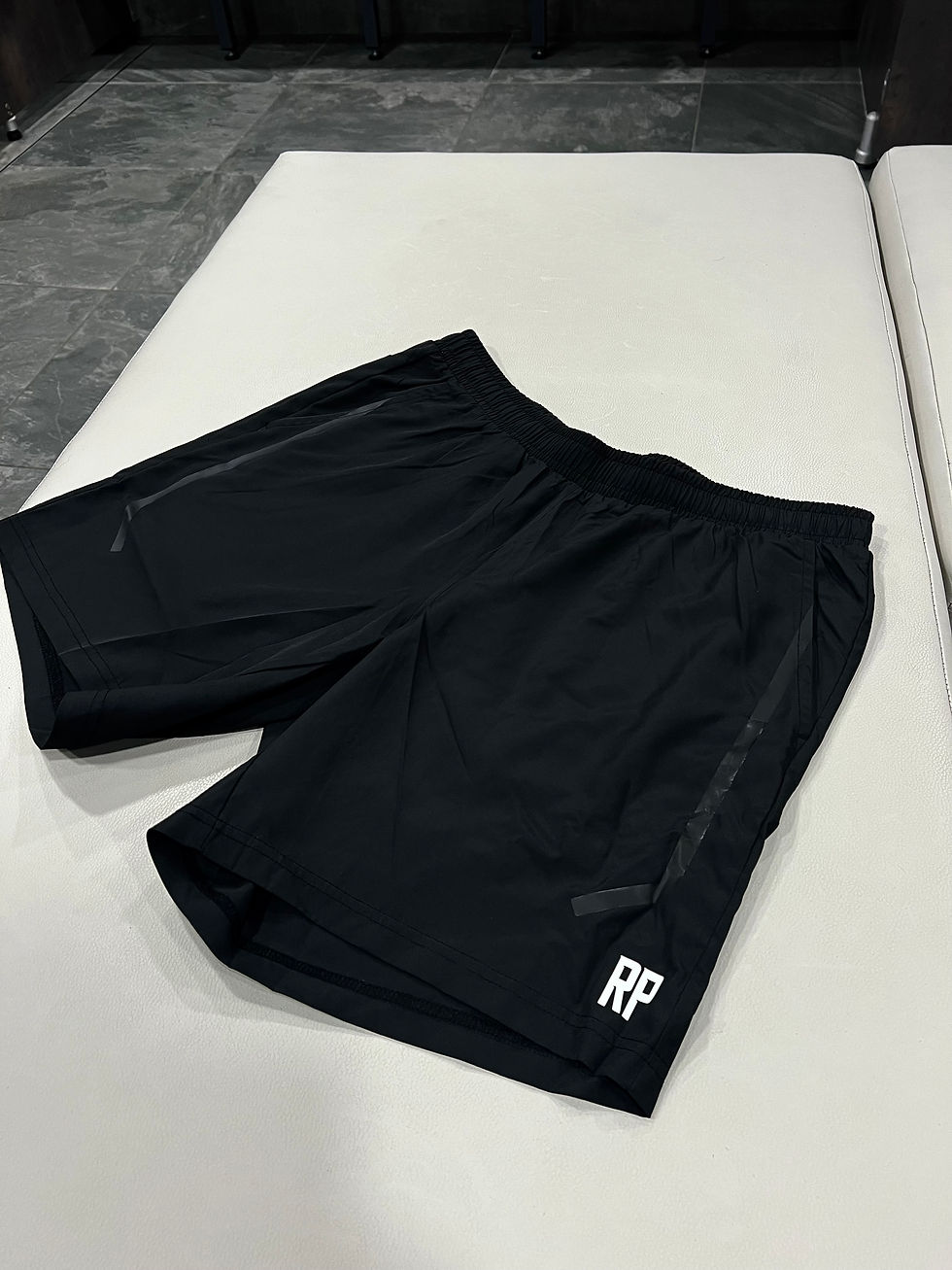 RP initial logo performance shorts front