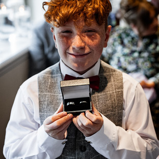 Boy with wedding rings