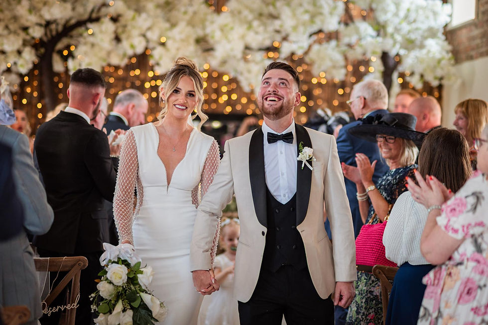 black tie couple exit their wedding