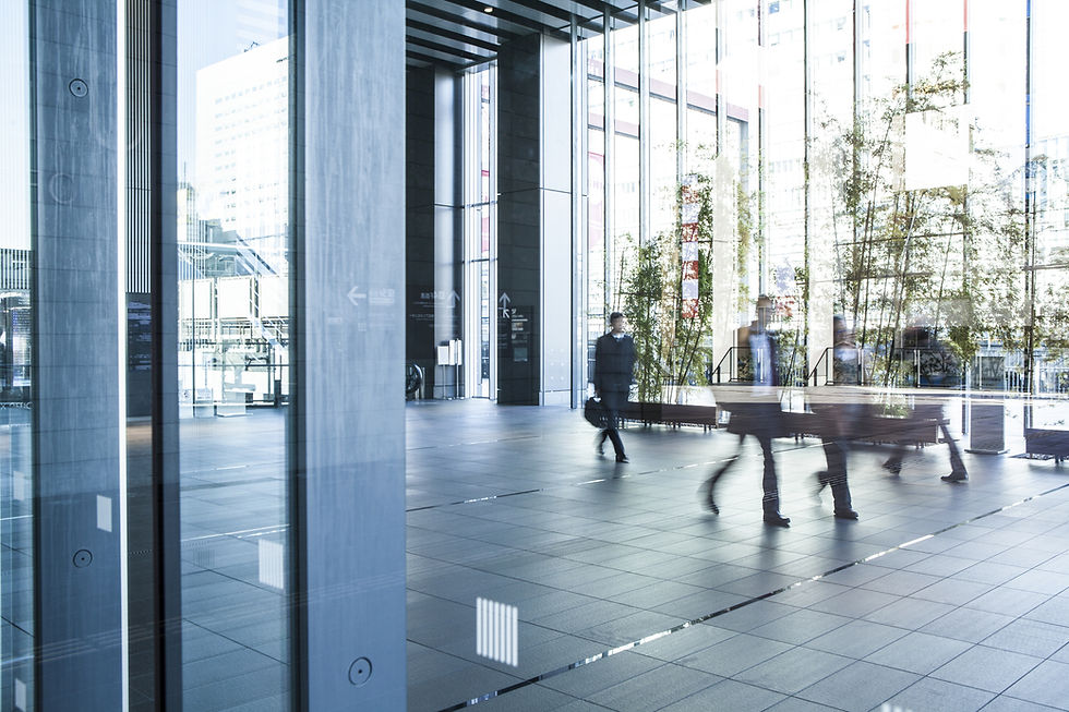 Office staff walking into an office building