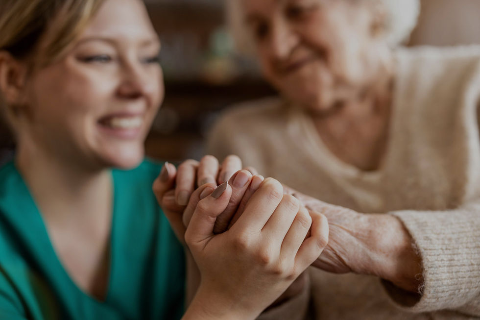 Senior Woman Nurse Holding Hands_edited.jpg