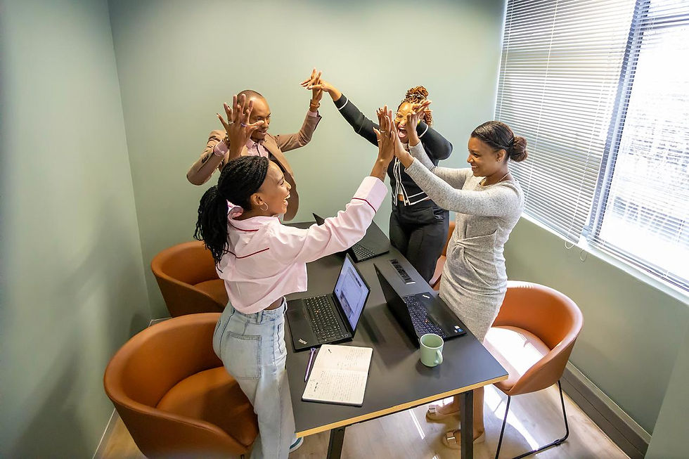 Greencastle South Africa Team cheering in a meeting room