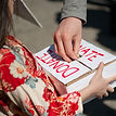 Hand putting money into a donation box