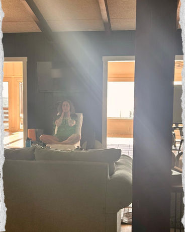 Atousa Raissyan leading a healing retreat meditation indoors with sunlight streaming through the windows in Maryland