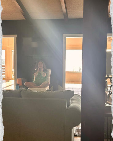 Atousa Raissyan leading a healing retreat meditation indoors with sunlight streaming through the windows in Maryland