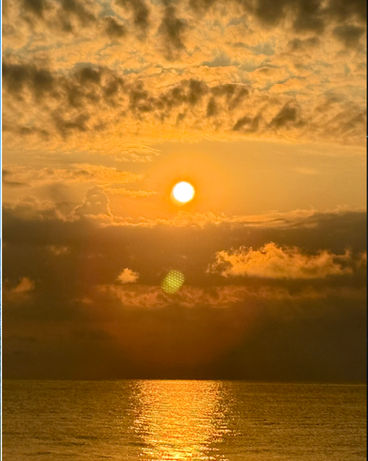 Golden sunrise over the Chesapeake Bay during the August 2025 healing retreat in Scotland, Maryland