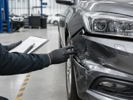 Scarborough auto body shop technician inspecting bumper and panel alignment on a daily driver