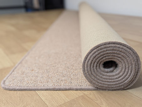 A custom-sized rug overlocked and rolled up