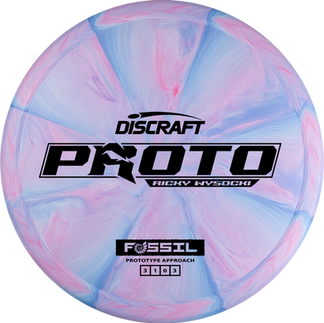 •	Ricky Wysocki Prototype Fossil midrange, front stamp centered on flight plate, Prototype Fossil midrange angled to highlight rim width and shoulder geometry, Fossil prototype in hand, focus on stamp and plastic texture against neutral backdrop, Stack of Prototype Fossil discs, color variations with matching prototype stamp, Prototype Fossil on fairway, midrange profile visible from low side angle, Close-up of Fossil prototype stamp, foil catching light across the design, Top-down of Prototype Fossil, flatness and parting line height visible, Side profile of Prototype Fossil rim showing midrange wing and bead detail