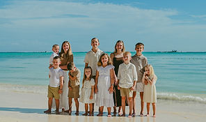 Family with children during a family photoshoot on the beach in Punta Cana