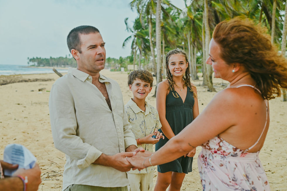 Family celebrating a heartfelt vow renewal ceremony in Punta Cana with their two children