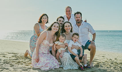 Multigenerational family with young children during a family photoshoot at Playa Esmeralda in Miches, Dominican Republic.