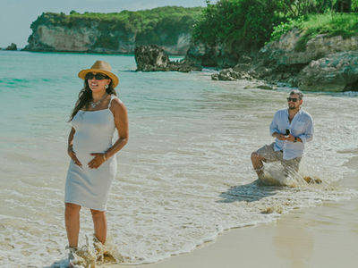 Pedro surprises Maria with a marriage proposal during their sunrise maternity photoshoot at Macao Beach in Punta Cana.