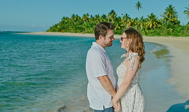 Couple during a family photoshoot at Playa Esmeralda in Miches