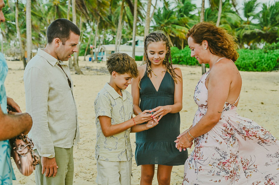 Children carrying their parents' wedding rings during a vow renewal ceremony in Punta Cana