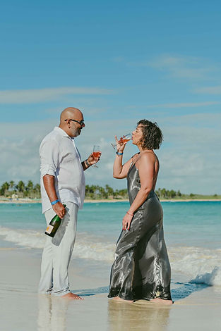 Couple celebrating their 25th wedding anniversary on Macao Beach in Punta Cana during a romantic photoshoot by the sea.