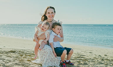 Mother with her two children during a family photoshoot at Playa Esmeralda in Miches