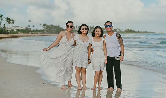 Family celebrating a graduation during a photoshoot at Macao Beach in Punta Cana