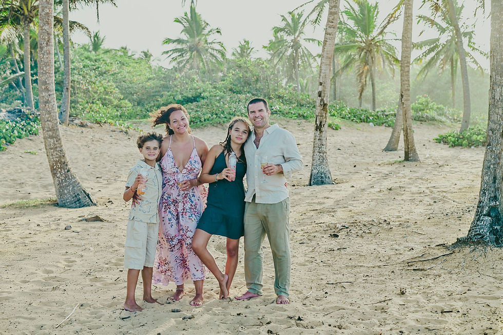Family portrait after a heartfelt vow renewal ceremony on Uvero Alto Beach, Punta Cana