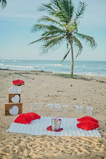 Romantic MARRY ME marriage proposal setup in Punta Cana with illuminated letters, flowers, decorative cushions and Caribbean Sea views in the Dominican Republic