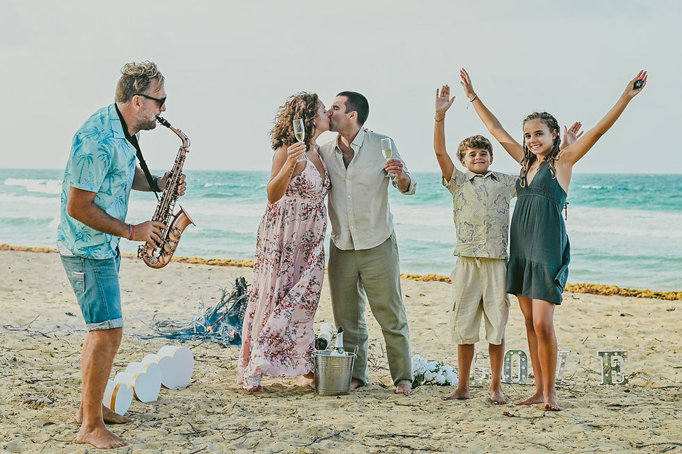 Champagne toast with live saxophone music after a Punta Cana vow renewal ceremony
