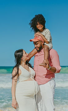 Family expecting a baby during a maternity photoshoot at Macao Beach, near Dreams Macao Beach Punta Cana.