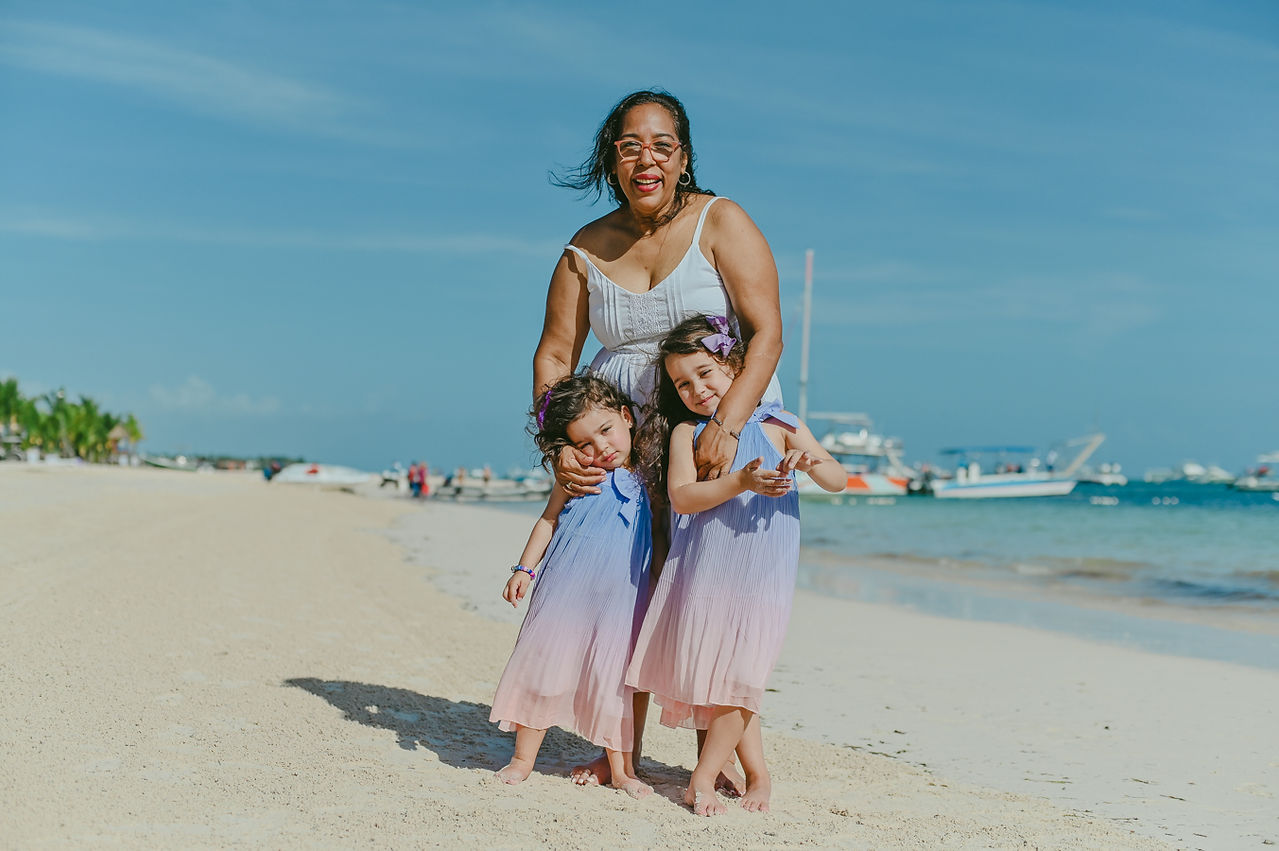 Grandmother with two little girls on the beach near Barceló Bávaro Palace