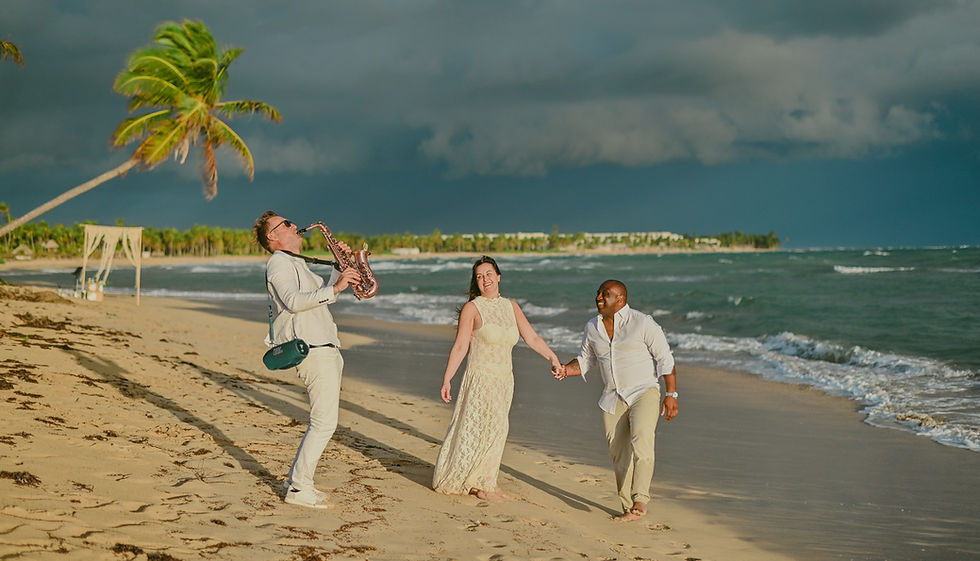 punta-cana-photographer-panoramic-couple-singing-saxophonist-beach-wedding-sunrise-zoetry-