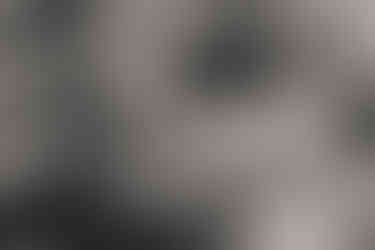 mom and dad giving newborn his first bath in the hospital