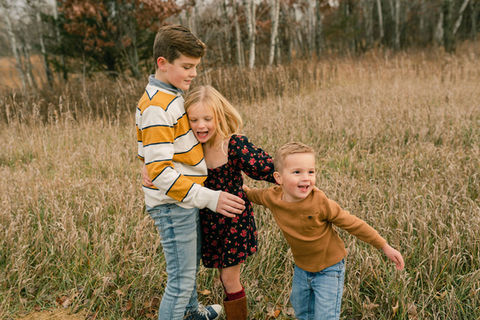 there kids playing in a field
