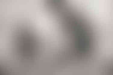 parents giving newborn baby his first bath in the hospital