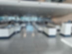 Modern airport security checkpoint with multiple lanes