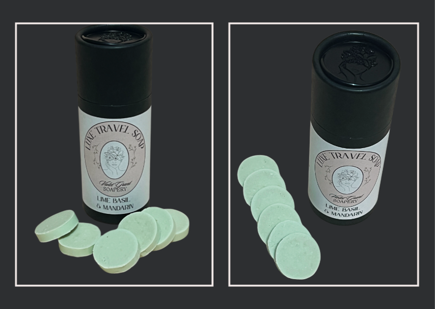 Lime basil mandarin travel soap with mint-green tablets beside a black bottle on a dark background, featuring an intricate label design.