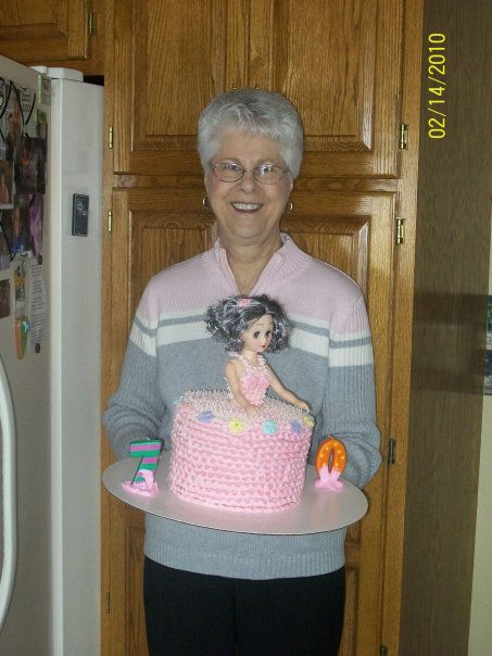 Mom with the birthday cake I made for her 70th birthday.
