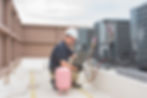 HVAC Technician using refrigerant