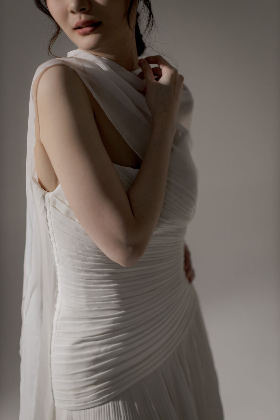 Eye-level view of a bespoke wedding dress displayed in a bridal studio in Singapore