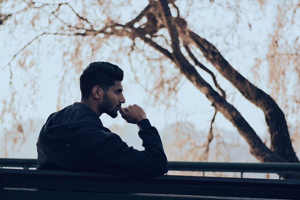 Man sitting alone on a park bench in deep thought, representing why antidepressants don't work for everyone and the importance of exploring personalized depression treatment options.