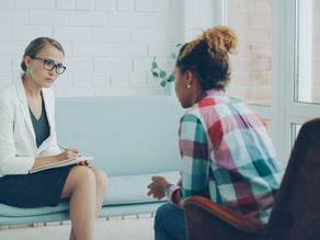 A woman meets with her psychiatrist to discuss OCD treatment