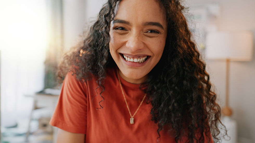 A young woman smiling, symbolizing the lasting relief that can come from TMS treatment