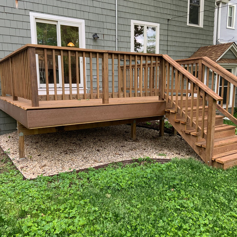 Treated lumber deck stained with Cedar color