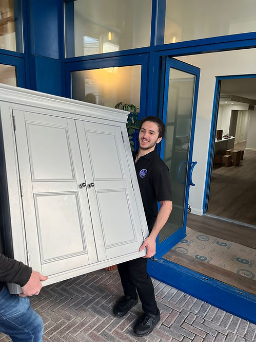 kingston and richmond mover carrying a piece of furniture