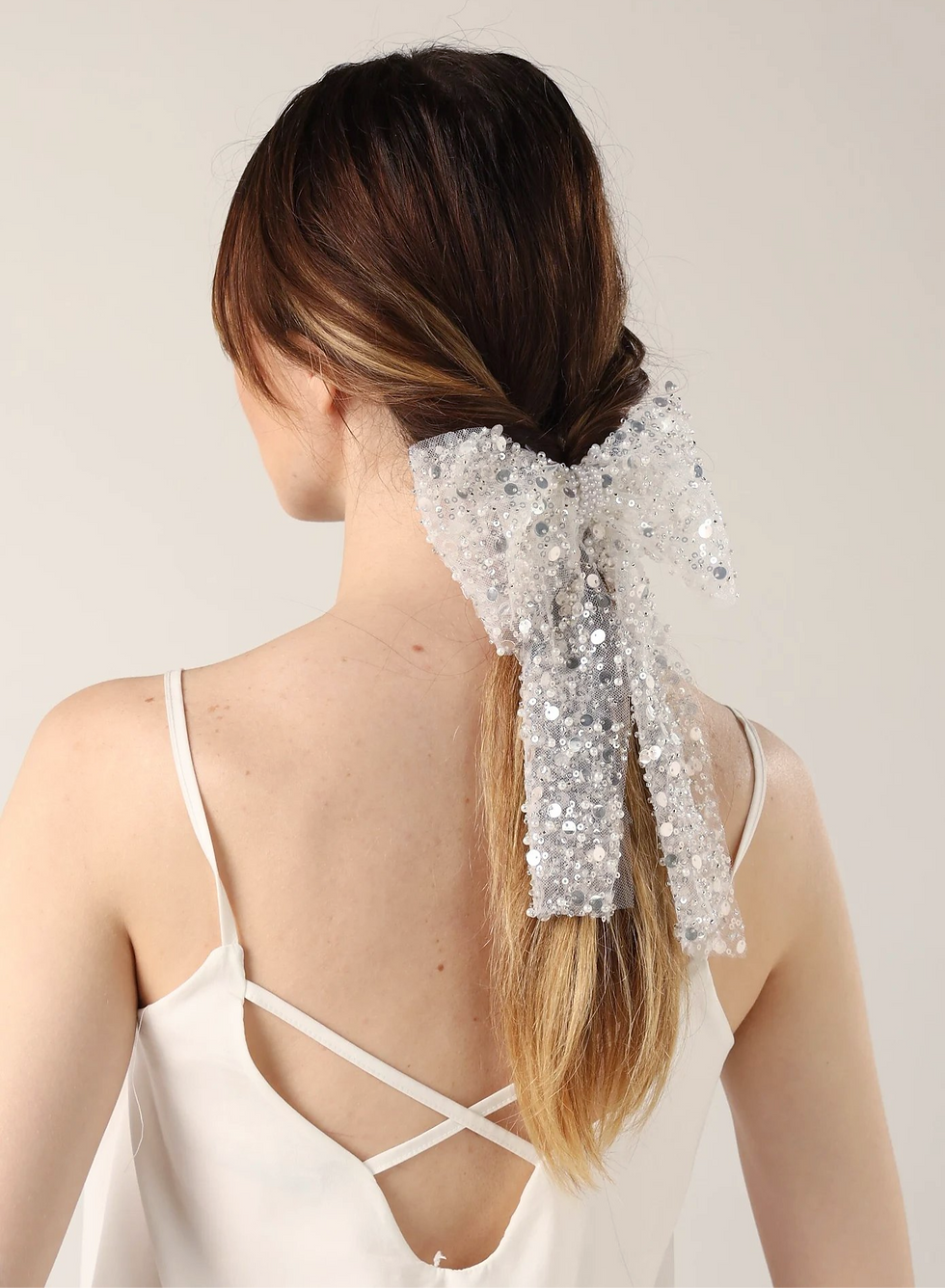 crystal hair bow pinned into brides hair